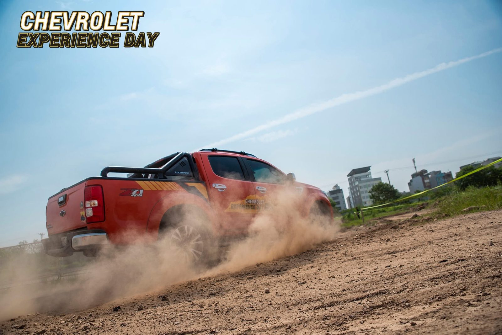Chevrolet Colorado drifting through dust