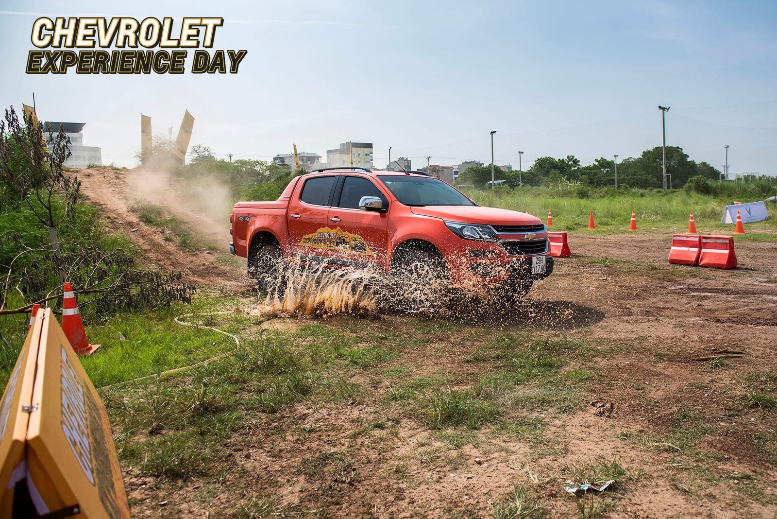 Chevrolet Colorado driving through water at speed