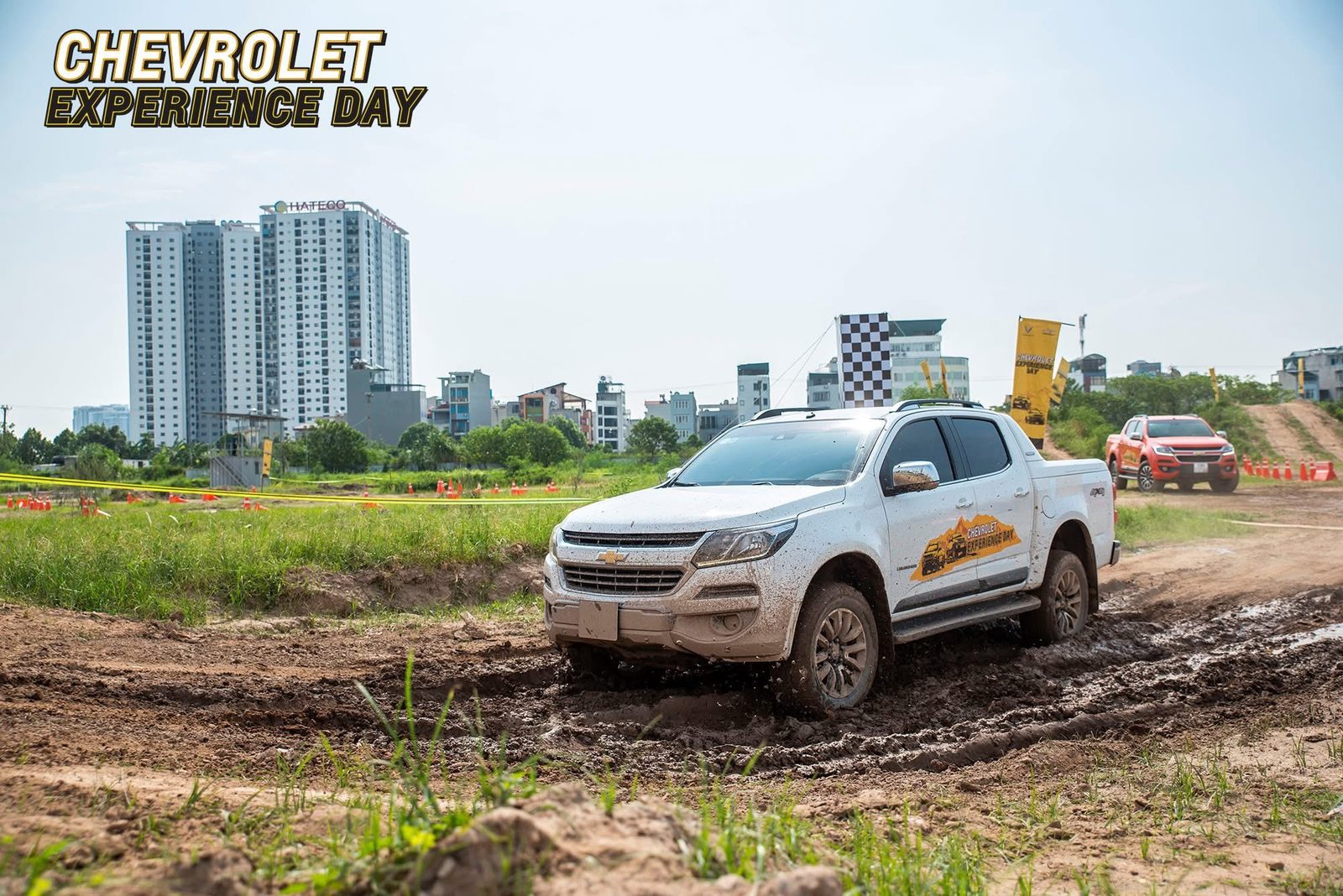 Two Chevrolet Trailblazers on a muddy off-road course