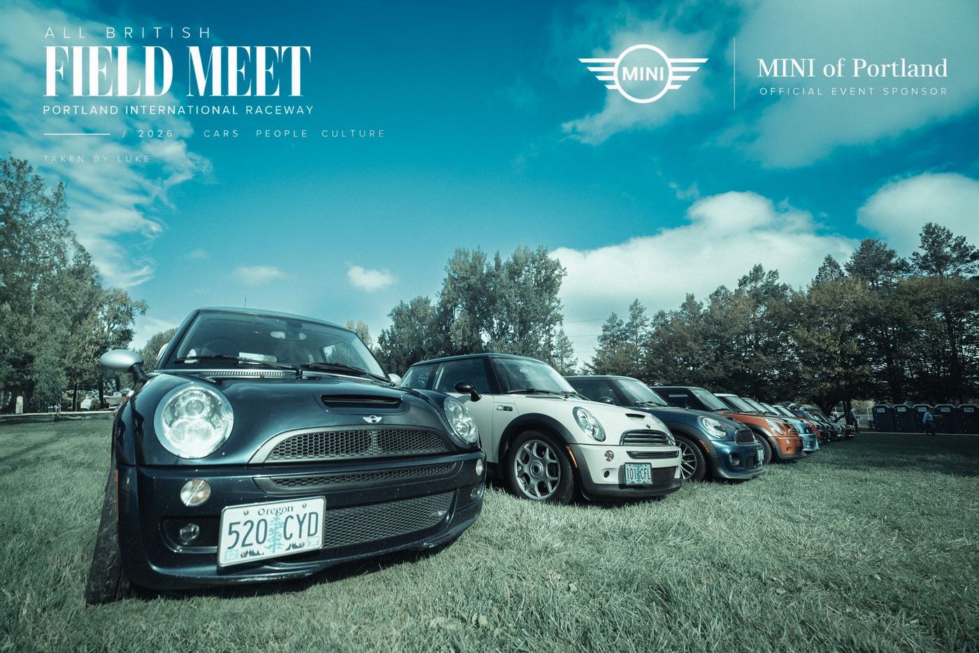 Modern MINI Coopers lined up under a blue sky